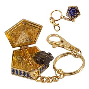 nob7229-nyckelring-noble-collection-harry-potter-metal-chocolate-frog-guld-4-cm